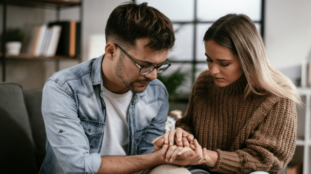 A couple praying together