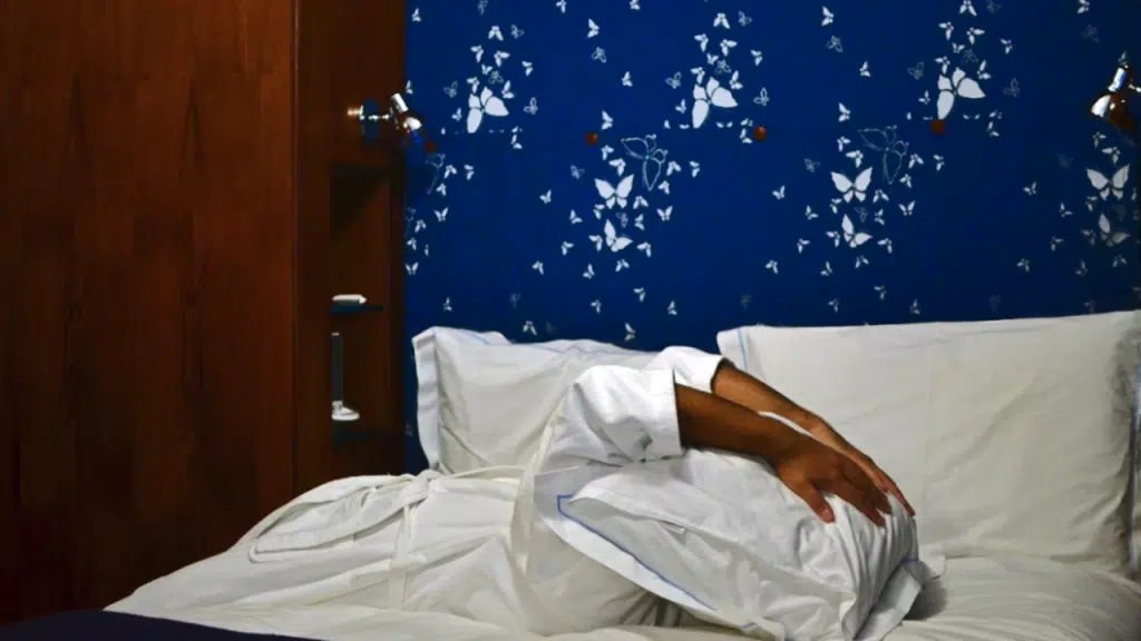 A man looking frustrated in bed