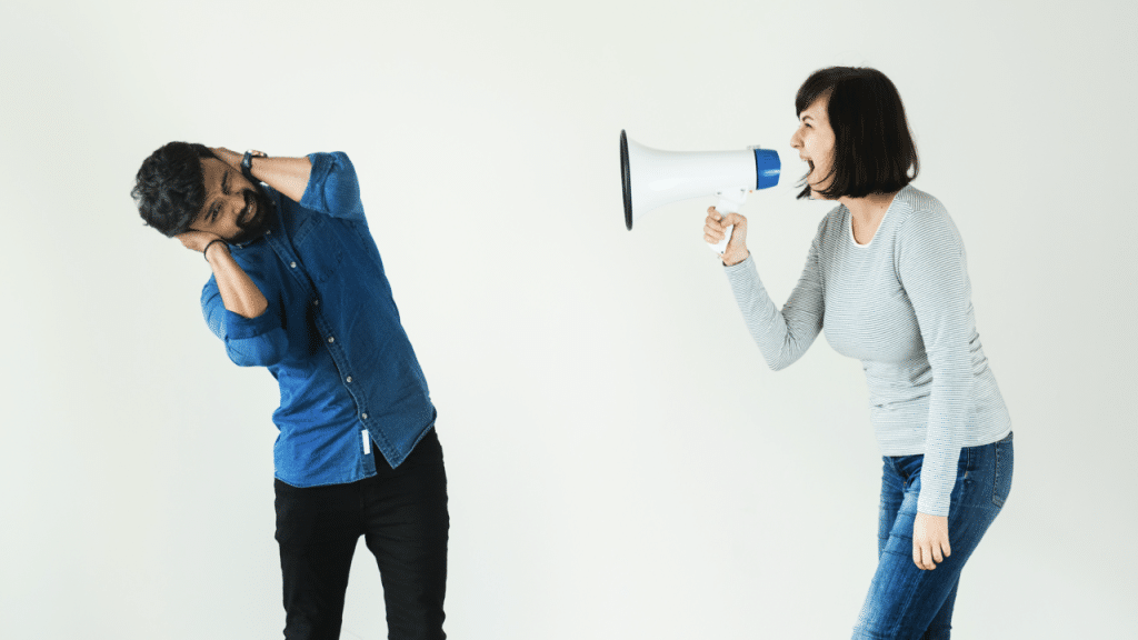 A woman yelling through a megaphone