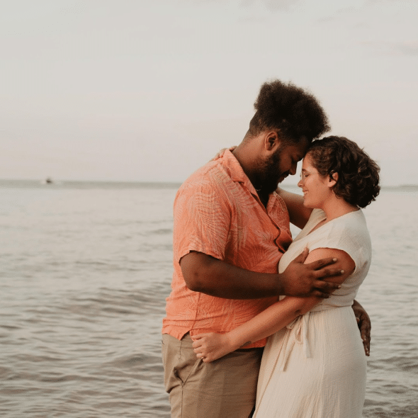 A man and woman facing each other