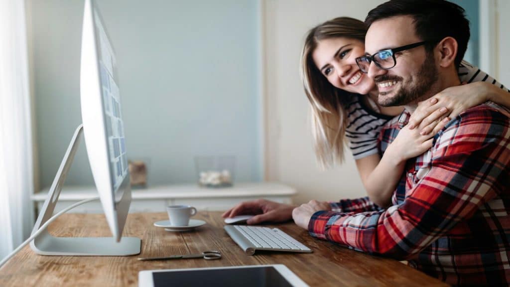 A couple looking at something on the computer