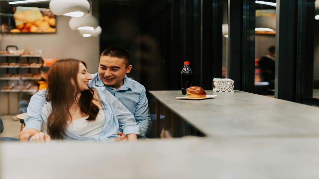 A couple looking happy at a cafe