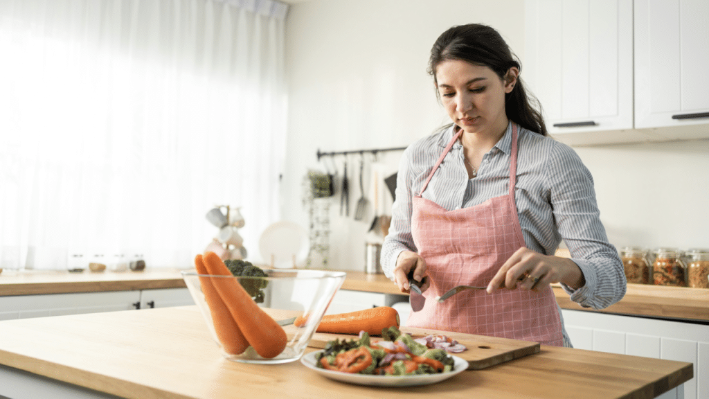 A woman looking serious while cooking