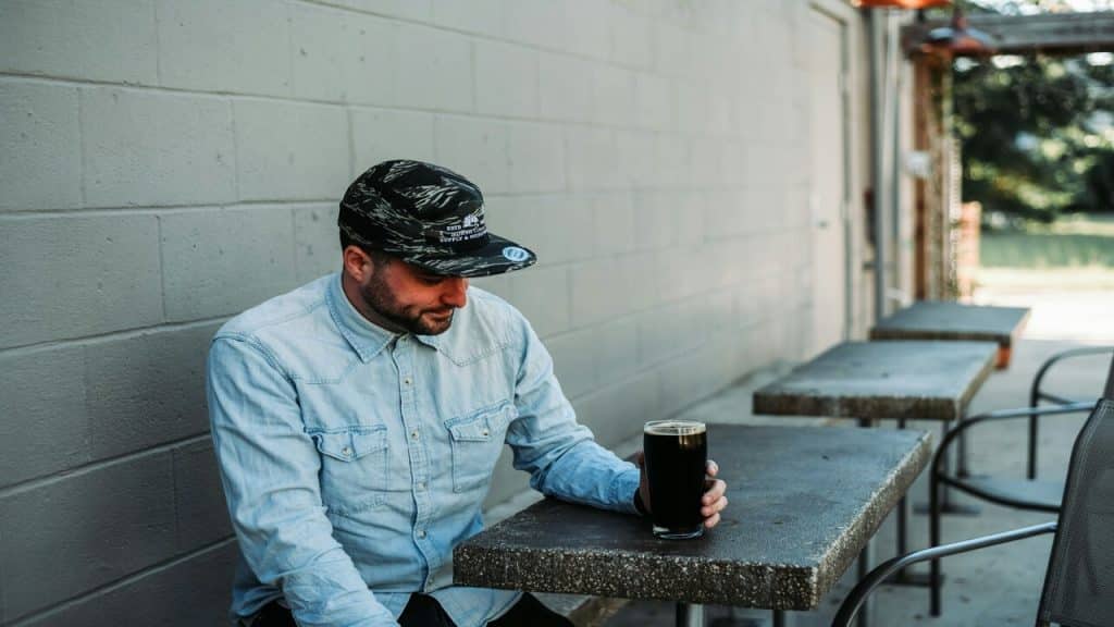 A man having beer by himself
