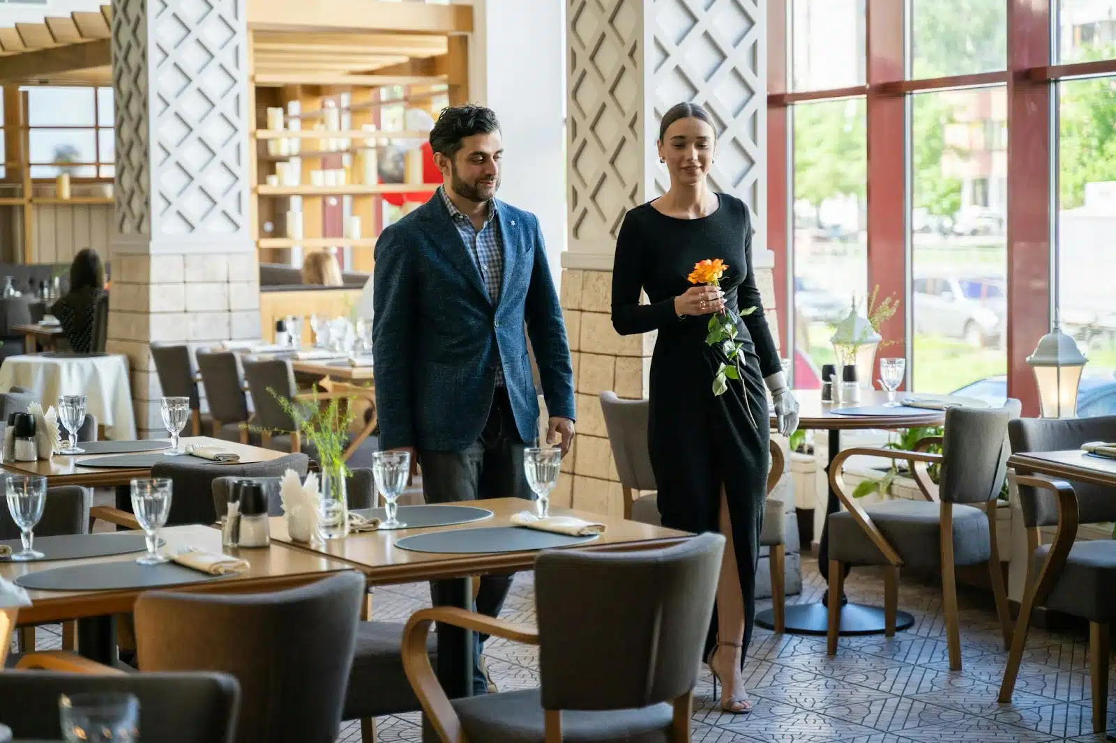 A man and woman just arrived at the restaurant.