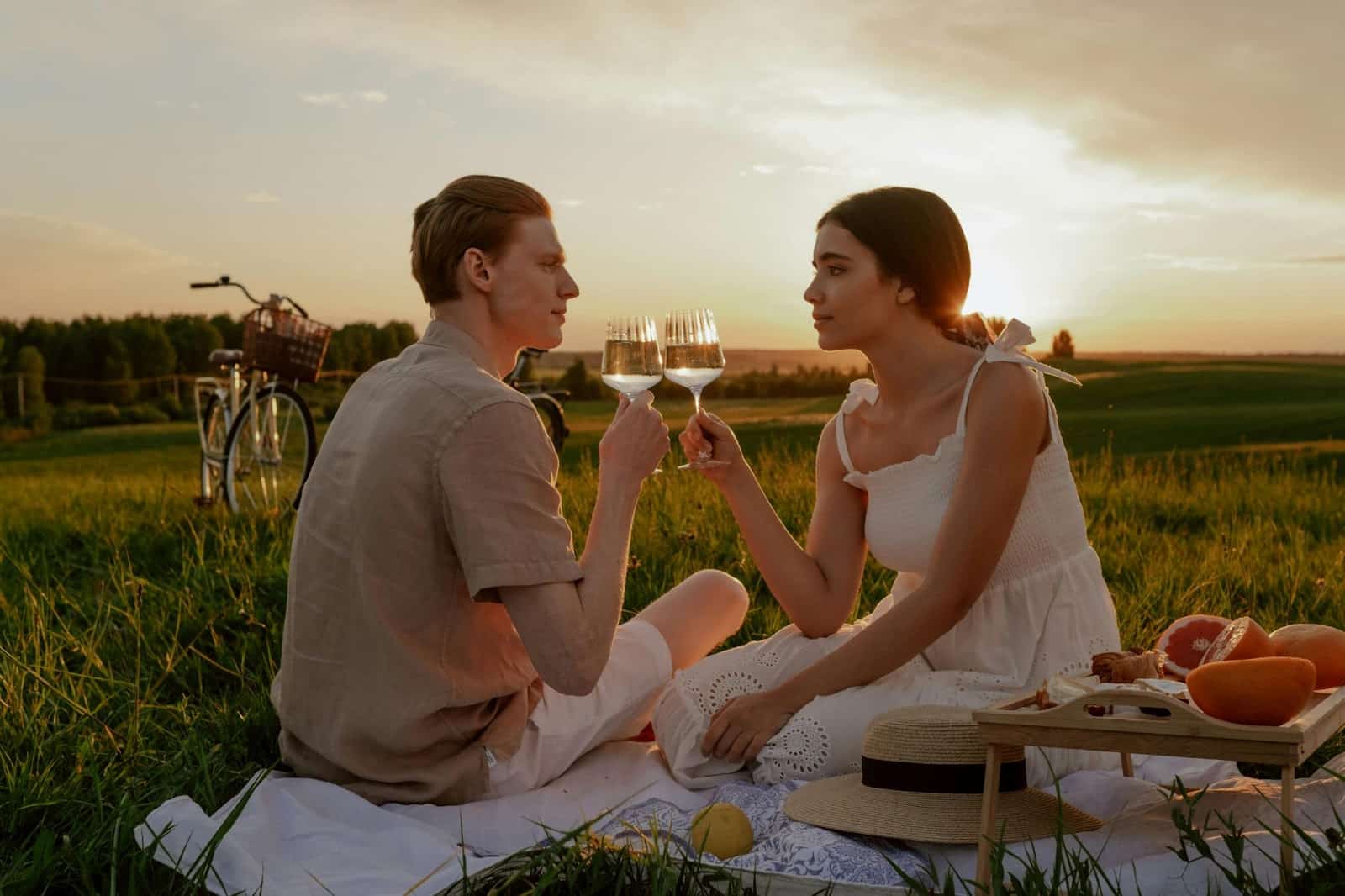 A man and woman talking while on a romantic date.
