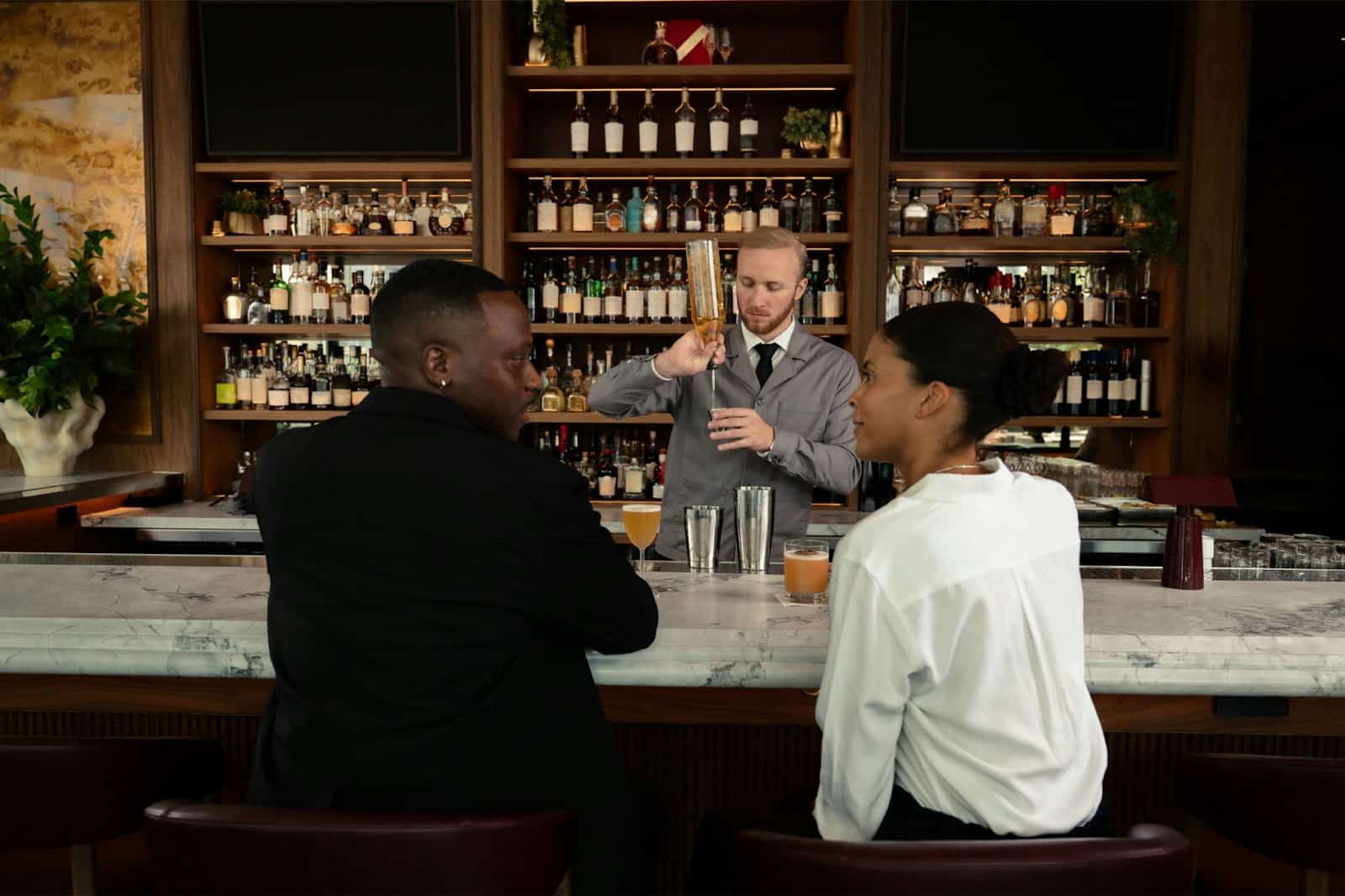 A man and woman at the bar.