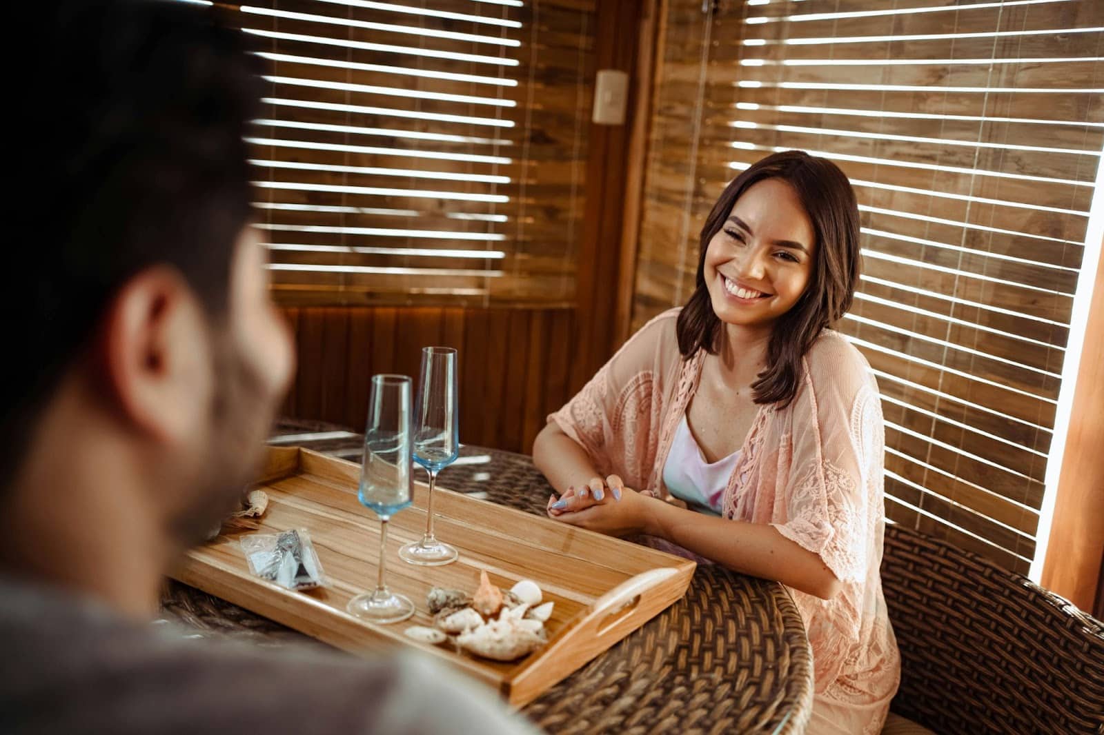 A woman smiling to man.