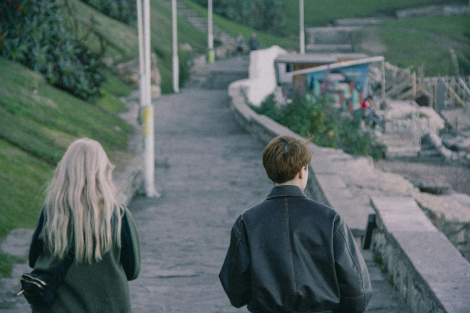 A man and woman walking.