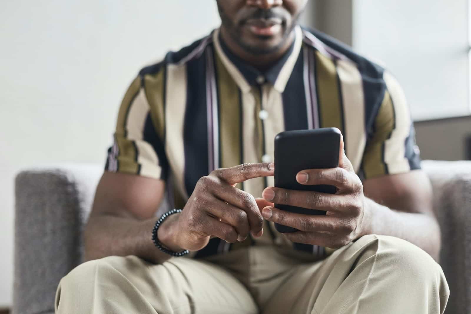 A man texting a woman.