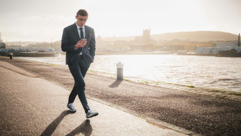 A man walking on a side walk