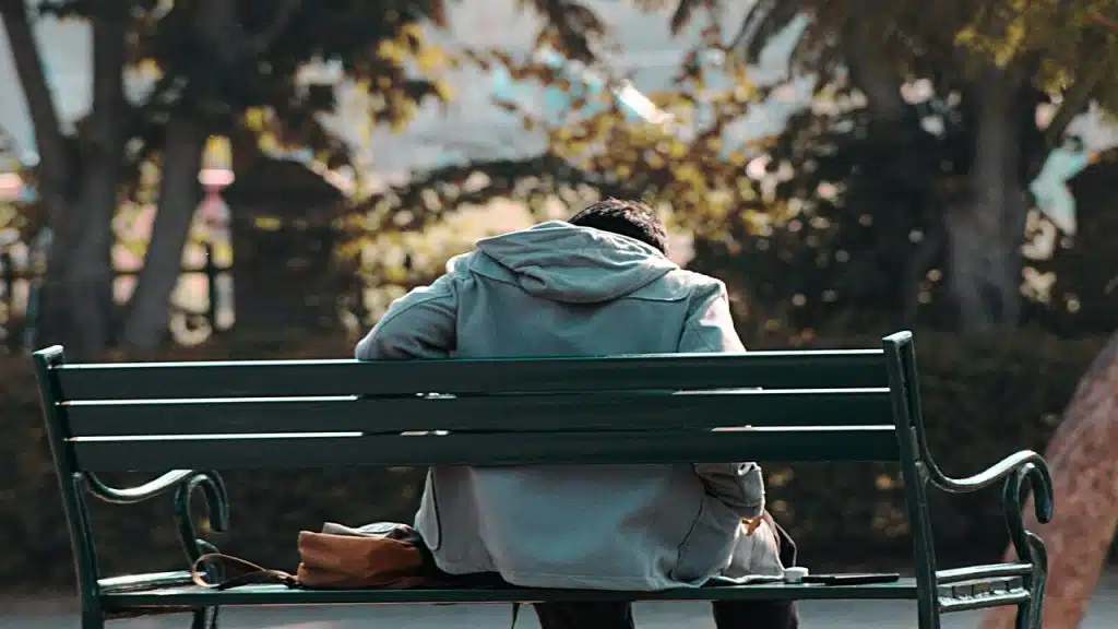 A man sitting on a park bench