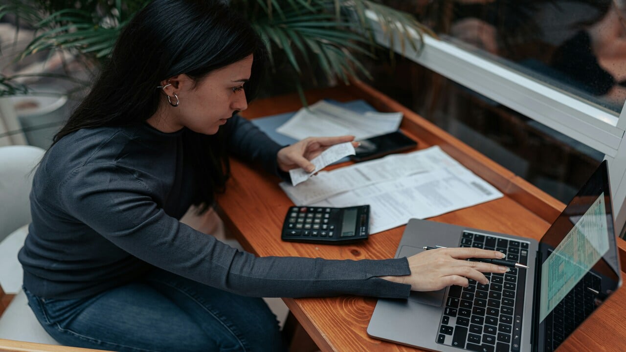 A woman doing her bills.