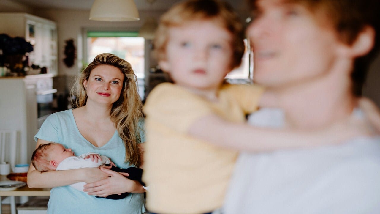 A wife looking at her ex and their baby.