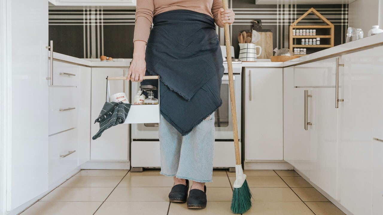 A woman getting ready to clean.