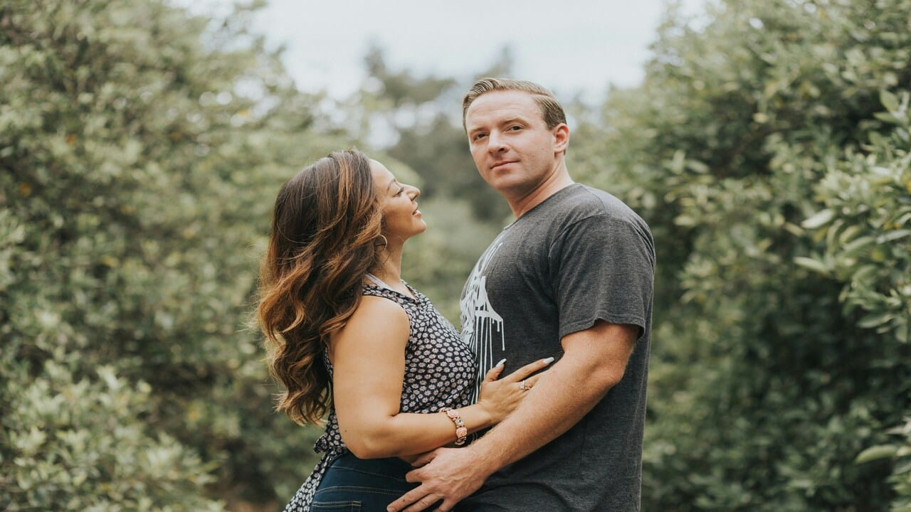 A wife looking lovingly at her husband.