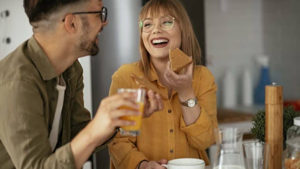 Woman playfully laughing at something a man said