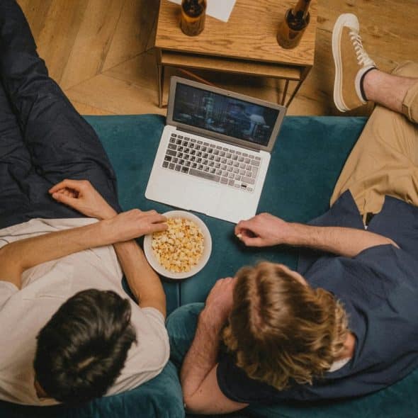 Two men watching a movie