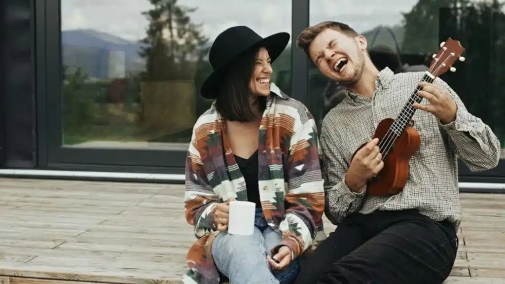 Man and woman laughing over a private joke in a casual setting