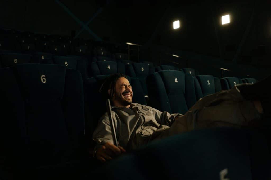 A man watching a movie alone