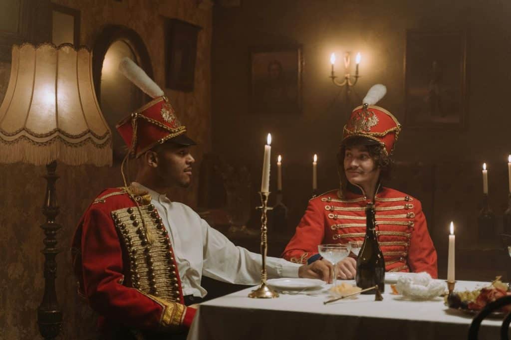 Two men wearing their costume 
