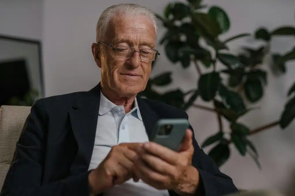 Old man using phone 