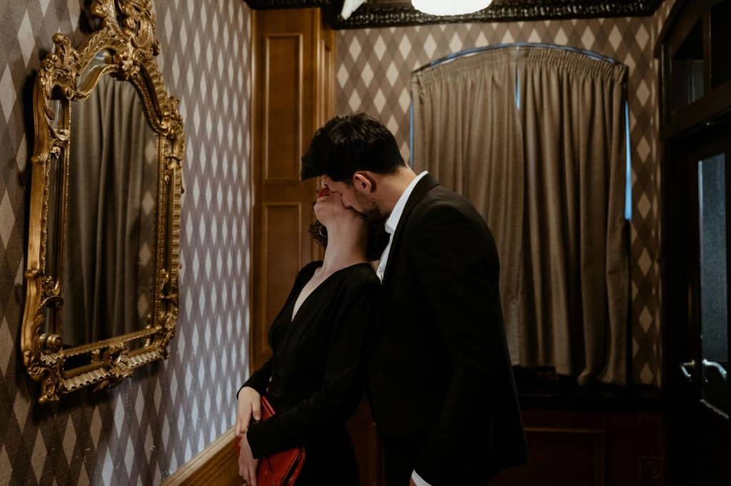 A man kissing a woman
