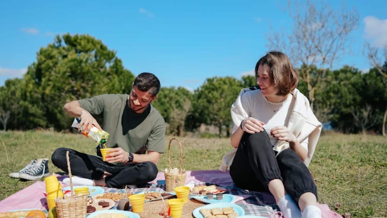 A husband surprising his wife with a spontaneous picnic.