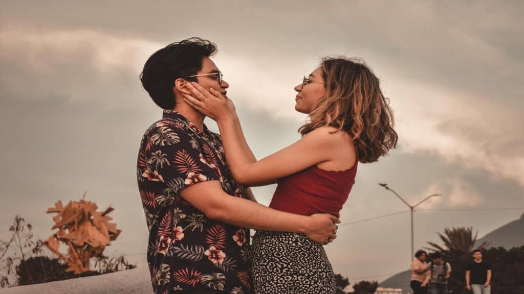A couple hugging in the park