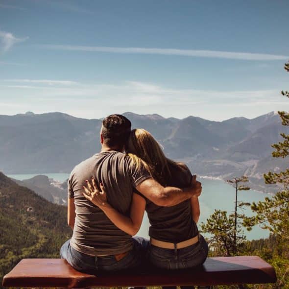 Couple leaning at each other