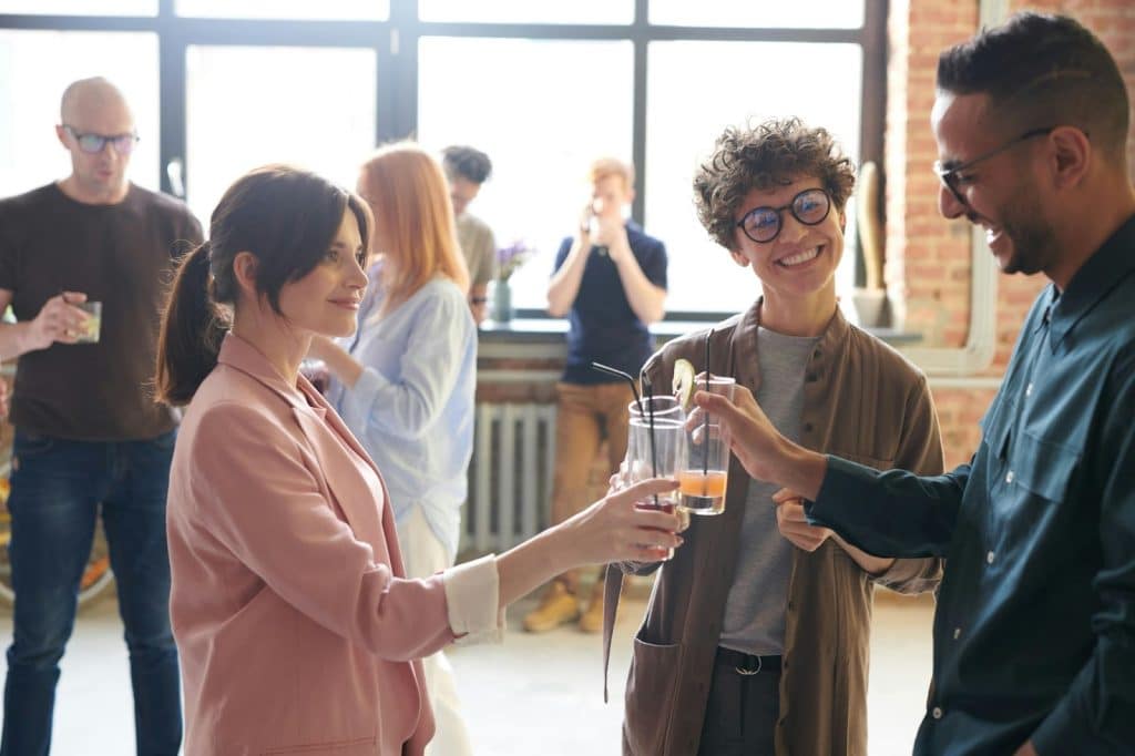 A man and woman with their friend in the middle