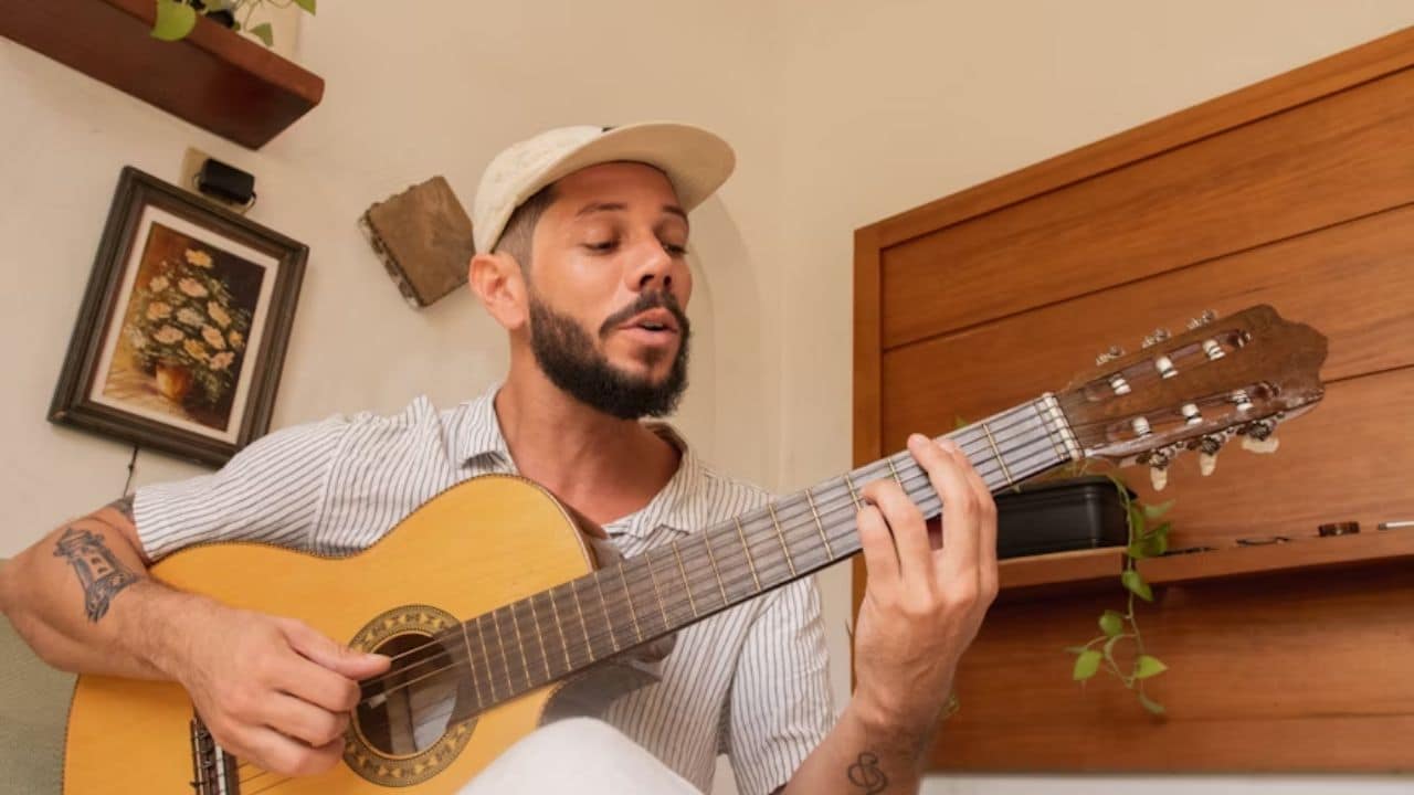 Husband playing guitar in his free time.