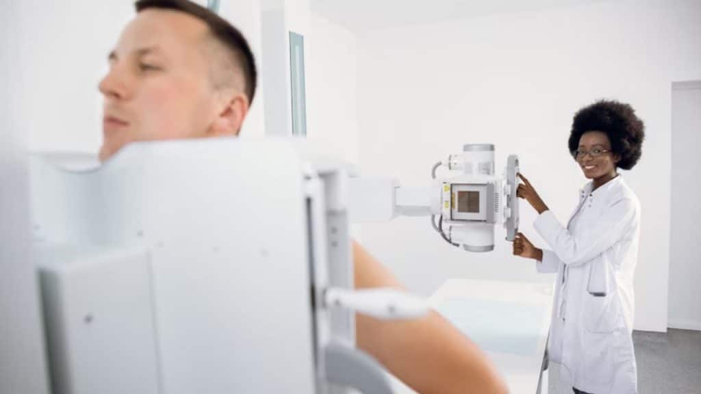 Man standing during an x ray chest scan