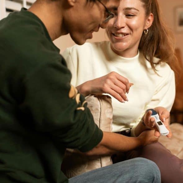 A showing a pregnancy test to a man