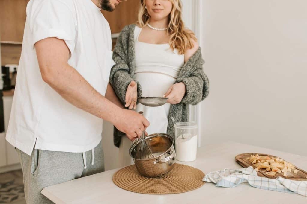 A man and woman cooking together