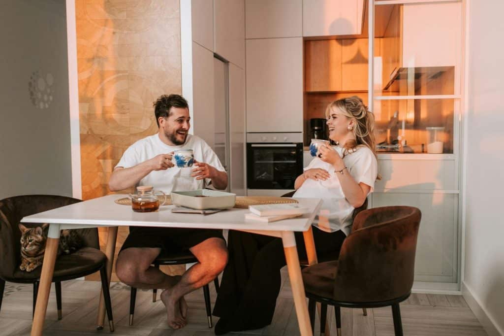 A man and woman talking while having a coffee