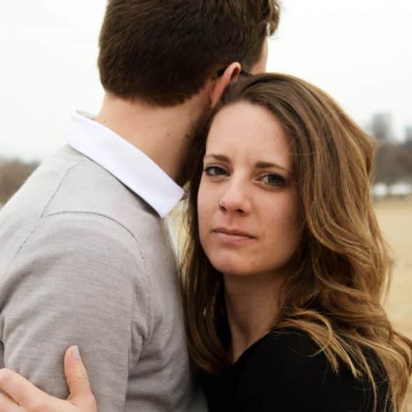A picture of  a man and a woman hugging each other.