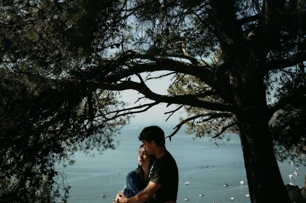 A man hugging a woman
