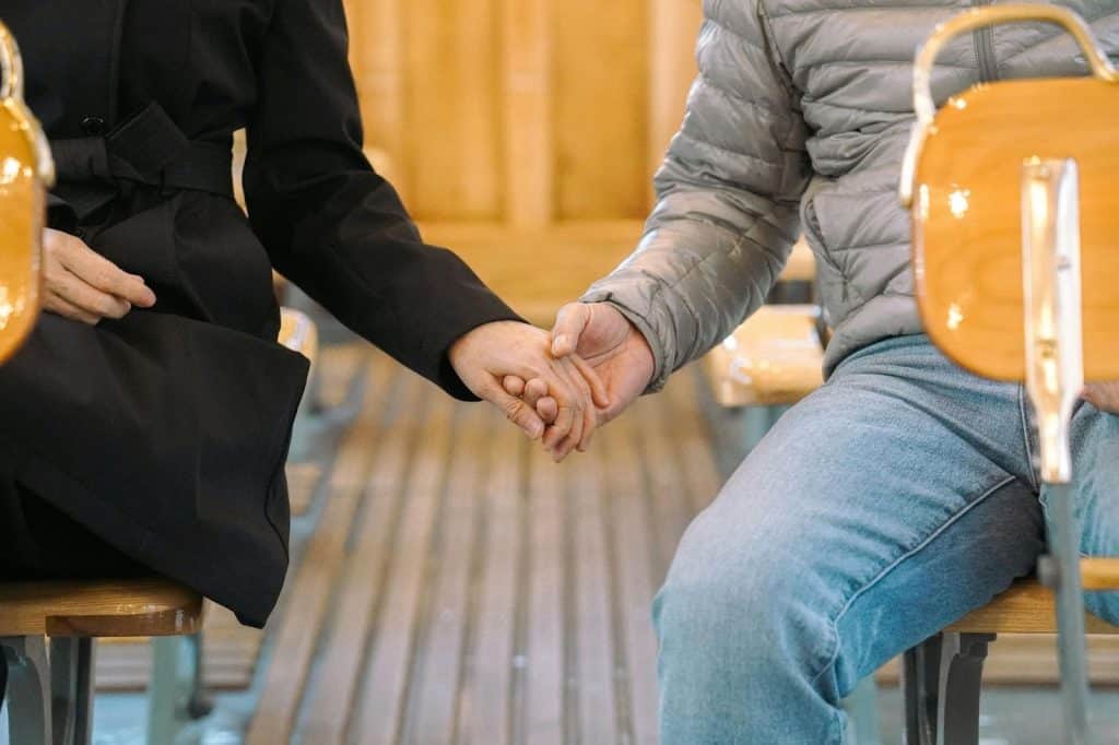 A man and woman holding hands