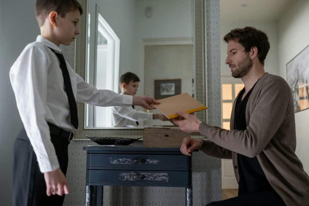 A man looking serious with his son