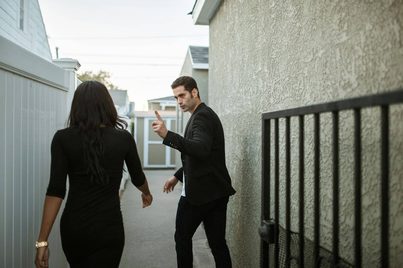 A man saying something to a woman.