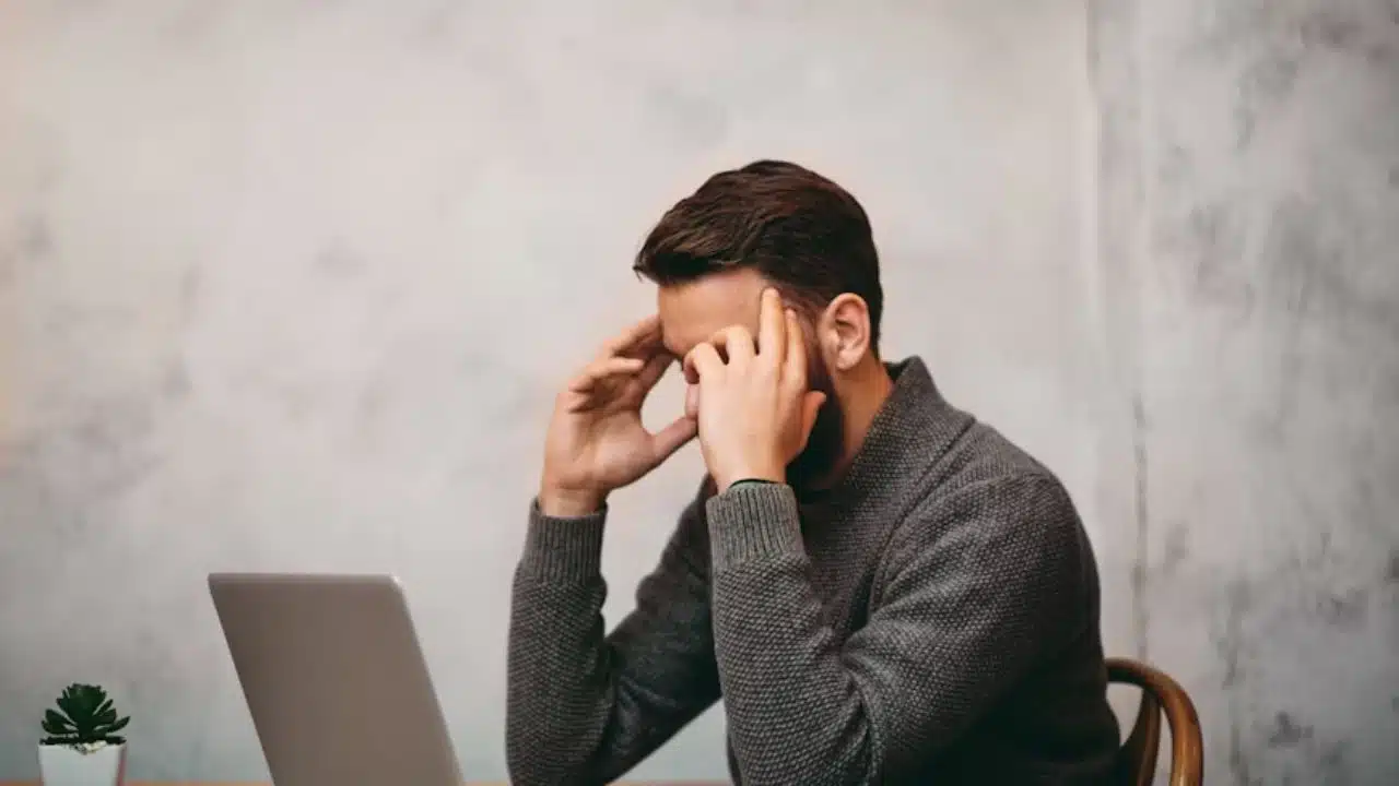Man looking down quietly after a difficult conversation.
