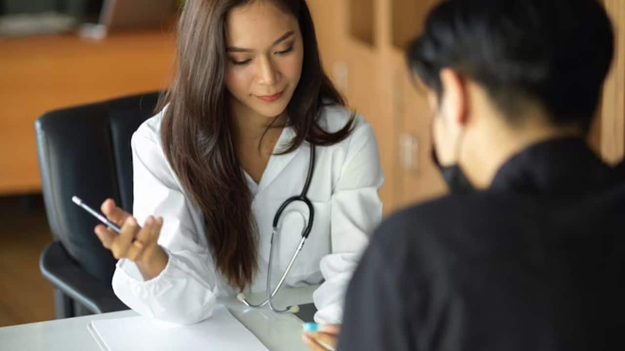 Man looking uncertain while doctor explains test results.
