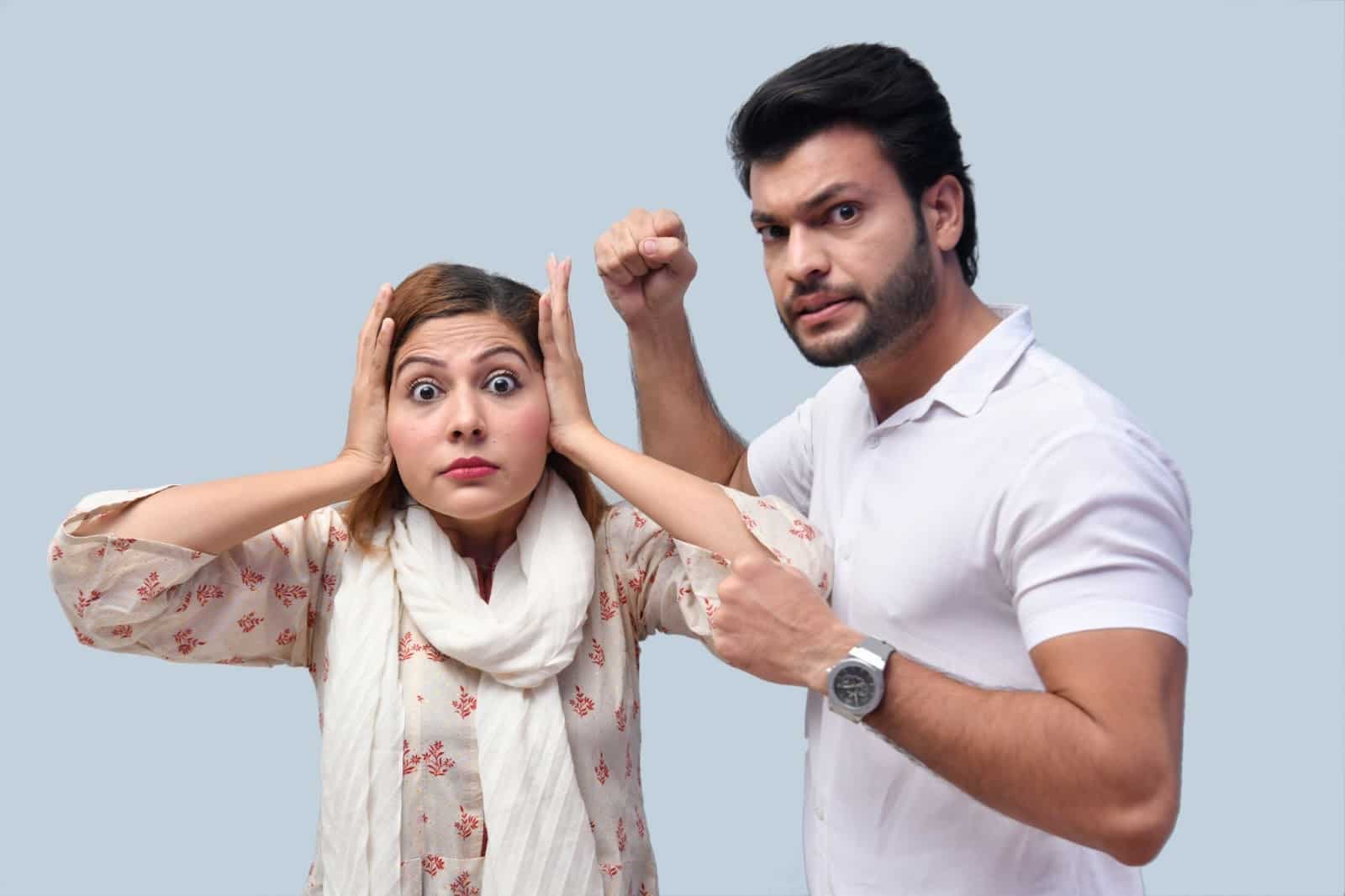 A man and woman fighting.