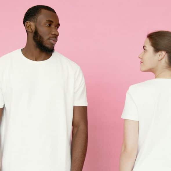 A woman looking at the man