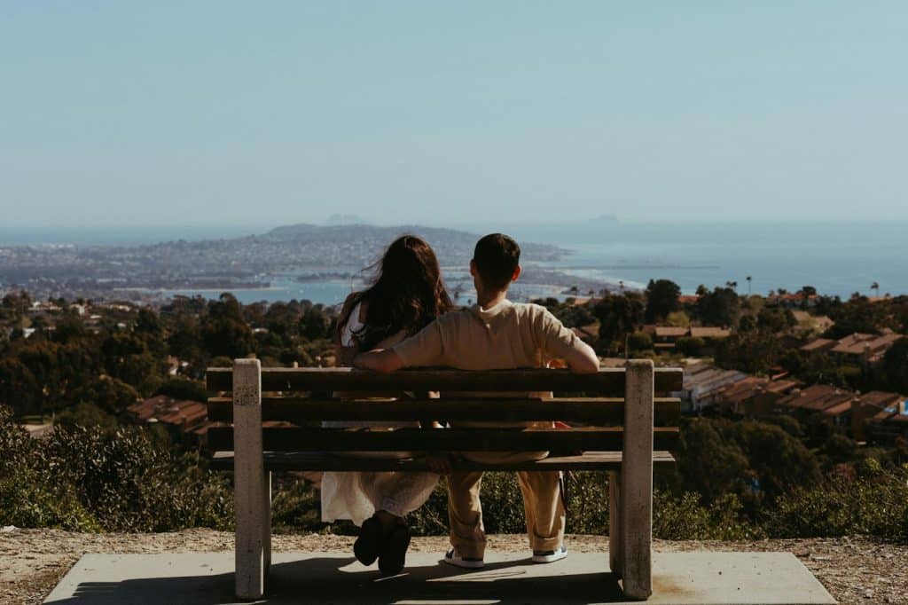 A married couple sitting at the bench