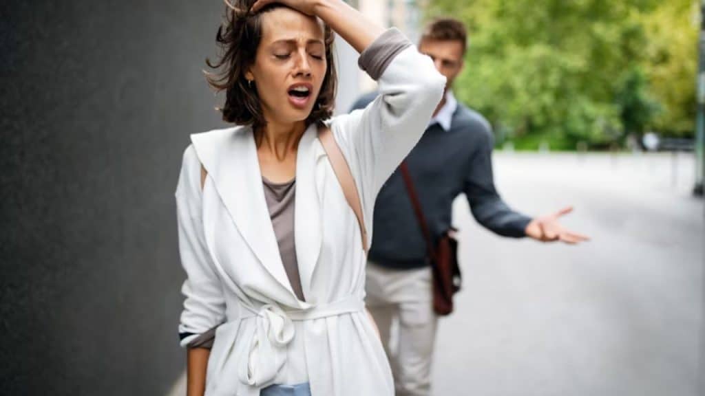 A woman looking frustrated during a decision making moment with her partner
