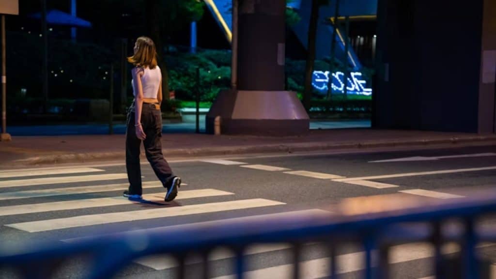 A woman walking confidently alone in a city setting
