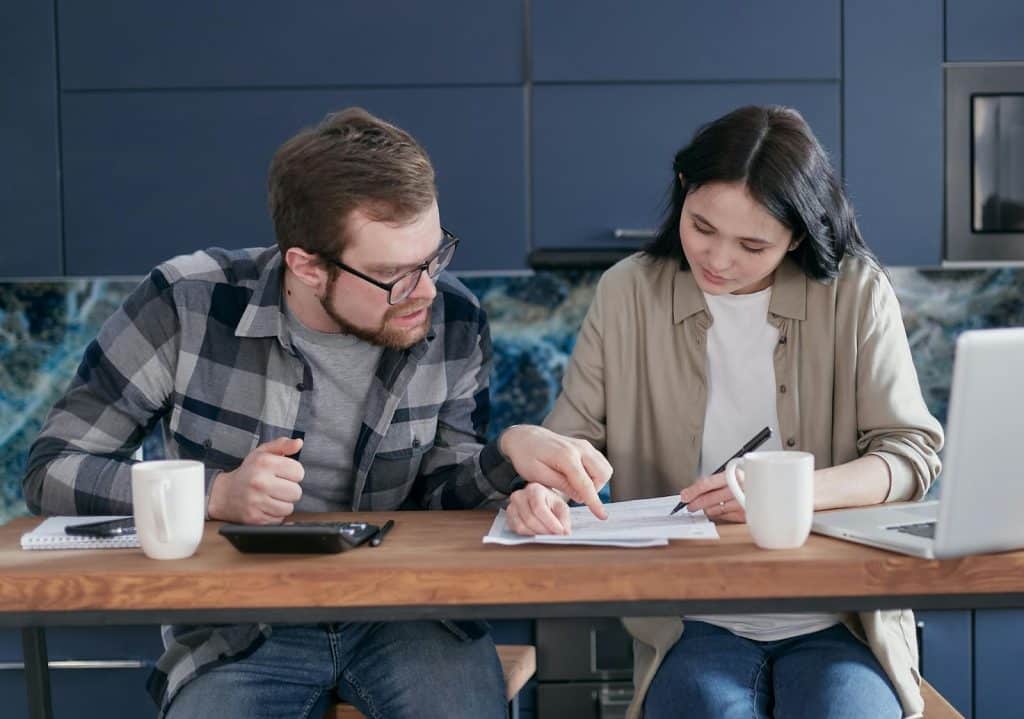 A man teaching something to a woman
