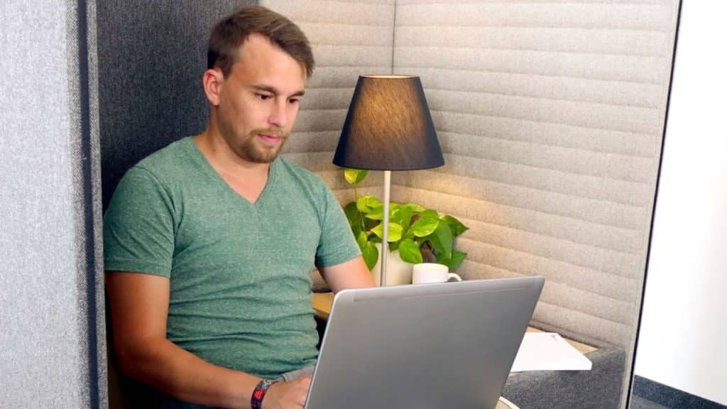 Man reviewing budget on laptop at home